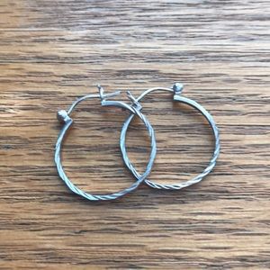 Small hoop silver earrings.